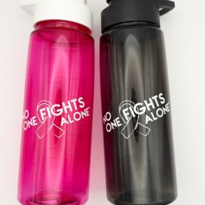 Image showing our No One Fights Alone® Plastic Water Bottle in smoke and in hot pink colors, both with 'No One Fights Alone' and a cancer awareness ribbon printed on the water bottle in white ink.
