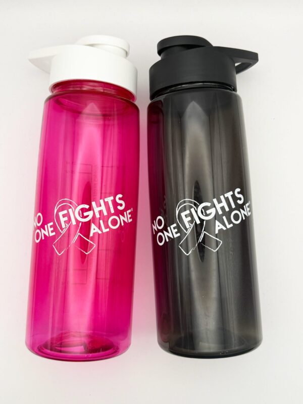 Image showing our No One Fights Alone® Plastic Water Bottle in smoke and in hot pink colors, both with 'No One Fights Alone' and a cancer awareness ribbon printed on the water bottle in white ink.